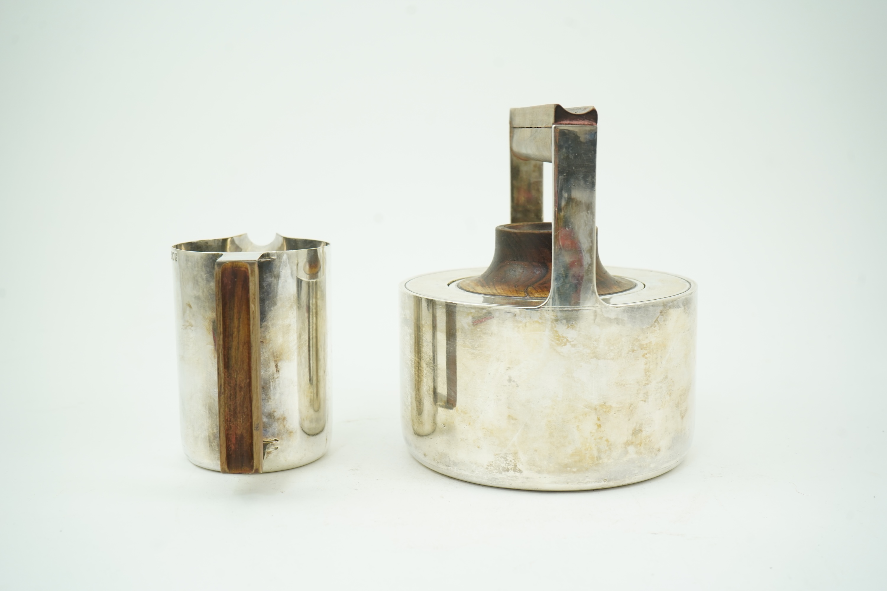 Roy Ridsdale (1942-2020): A silver tea kettle and matching cream jug
